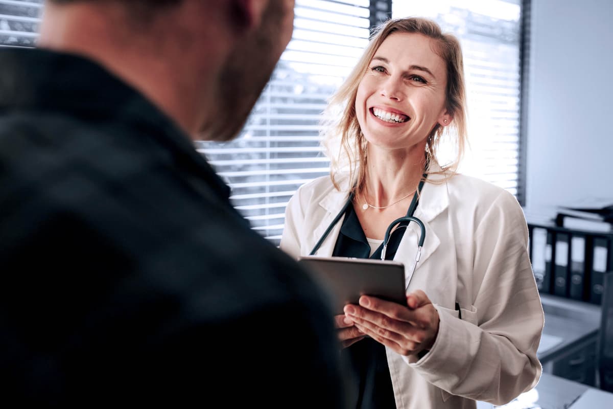 Friendly doctor interacting with her patient
