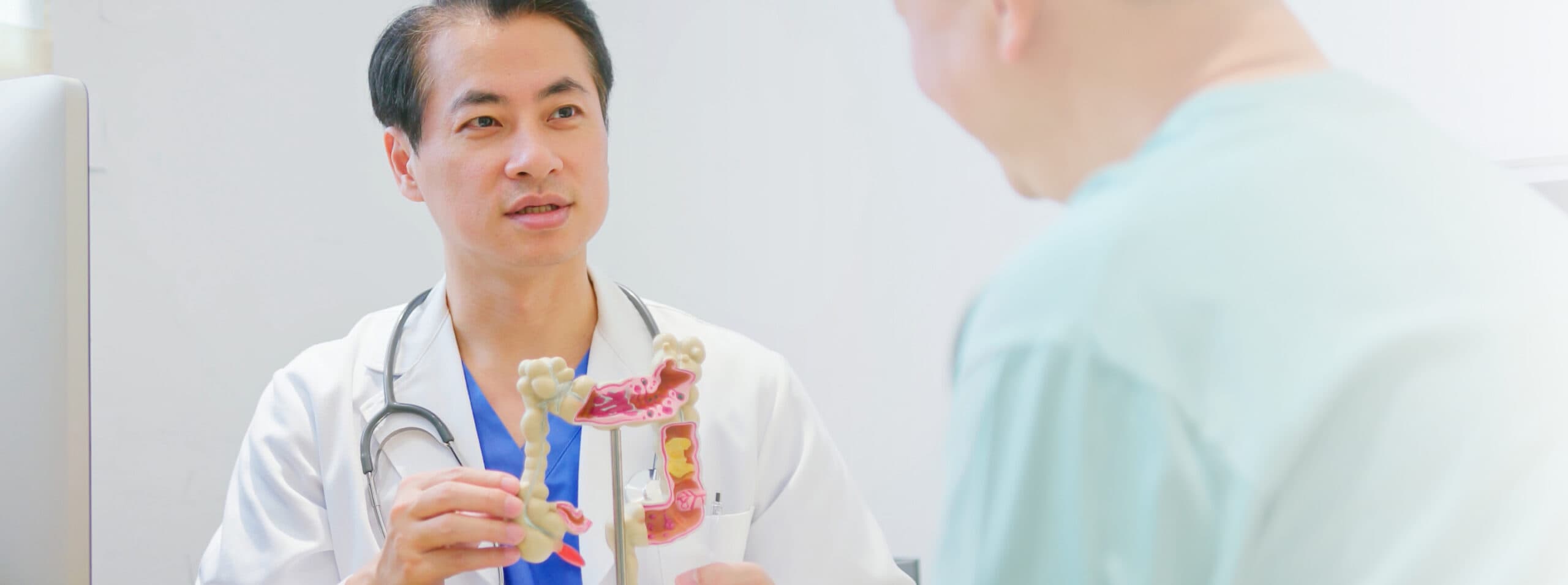 iStock-1560211440 Photo of a doctor explaining the anatomy of the colon to a patient