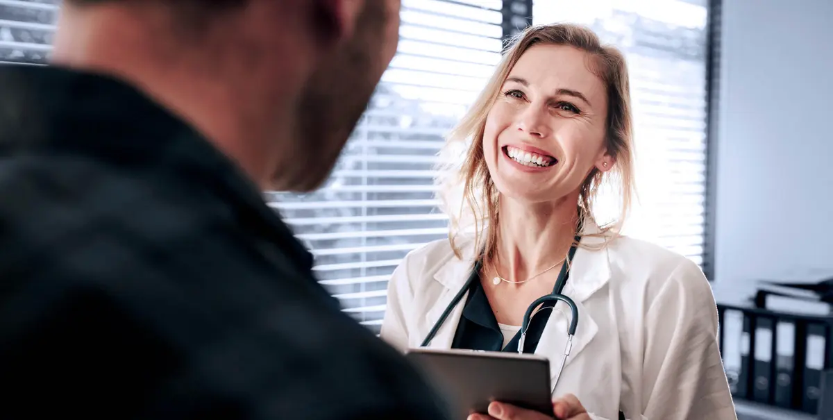 Friendly doctor interacting with her patient
